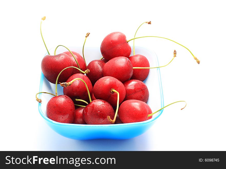 Bowl of fresh red cherries, isolated on white shot in studio. Bowl of fresh red cherries, isolated on white shot in studio