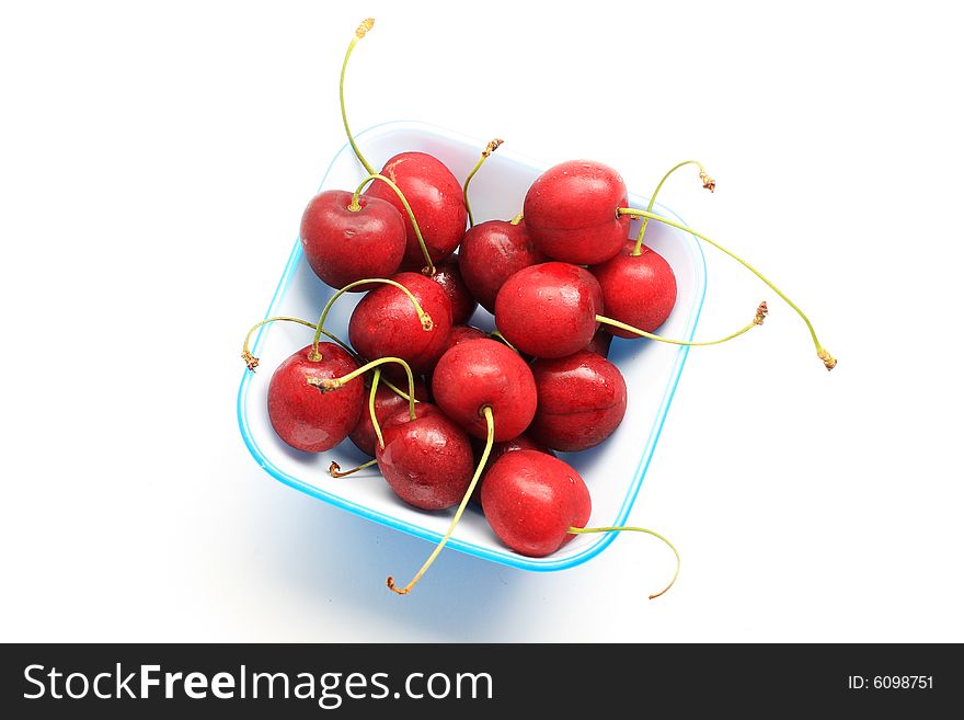 Bowl of fresh red cherries, isolated on white shot in studio. Bowl of fresh red cherries, isolated on white shot in studio