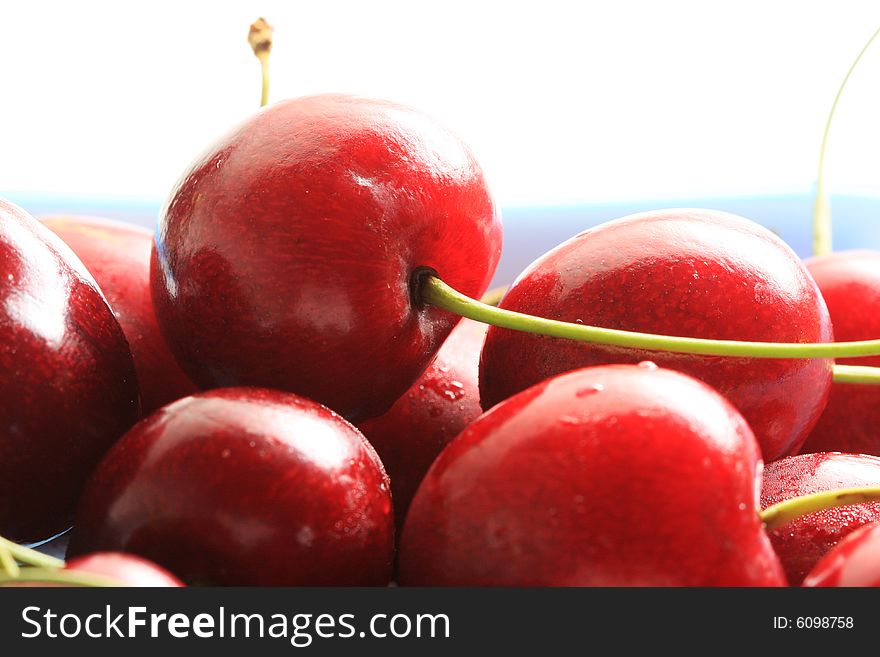 Fresh red cherries in a bowl, high key lighting. Fresh red cherries in a bowl, high key lighting