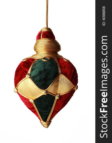 Christmas ball hanging from golden thread, shot in studio isolated on white. Perfect for your holiday designs or ads. Christmas ball hanging from golden thread, shot in studio isolated on white. Perfect for your holiday designs or ads