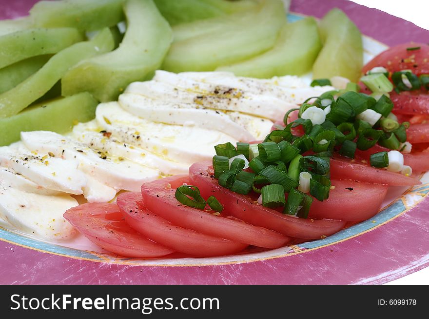 Image of a fresh salad with tomatoes, zucchini and feta. Image of a fresh salad with tomatoes, zucchini and feta