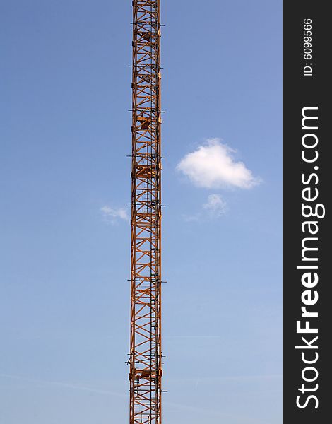 Construction crane with blue sky and cloud