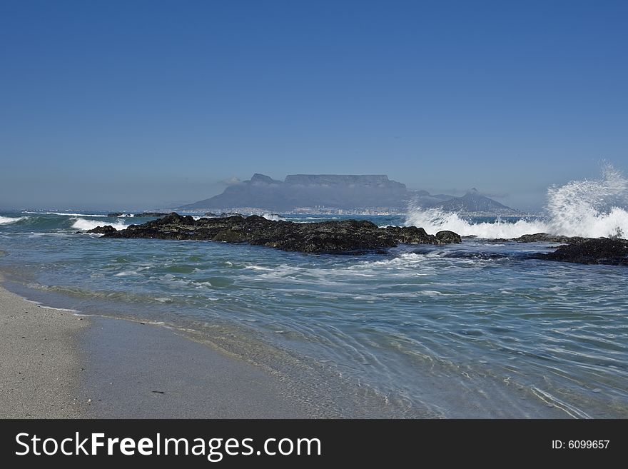 A view of Table Mountain in Cape Town, from Blauwberg beach on a sunny winters day. A view of Table Mountain in Cape Town, from Blauwberg beach on a sunny winters day