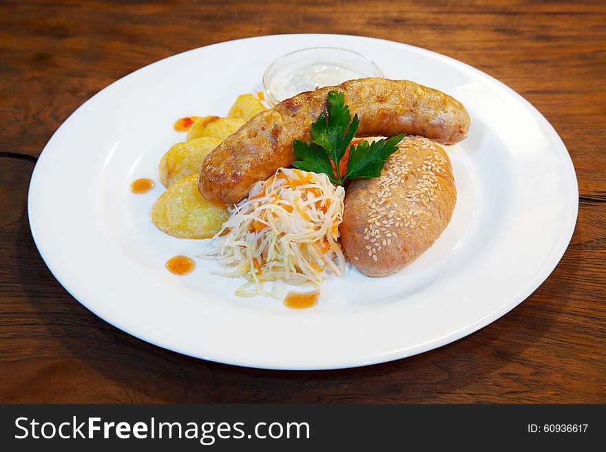 Sausages with vegetables on a plate