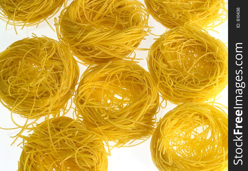 Noodle nests for soup, white background light. Noodle nests for soup, white background light