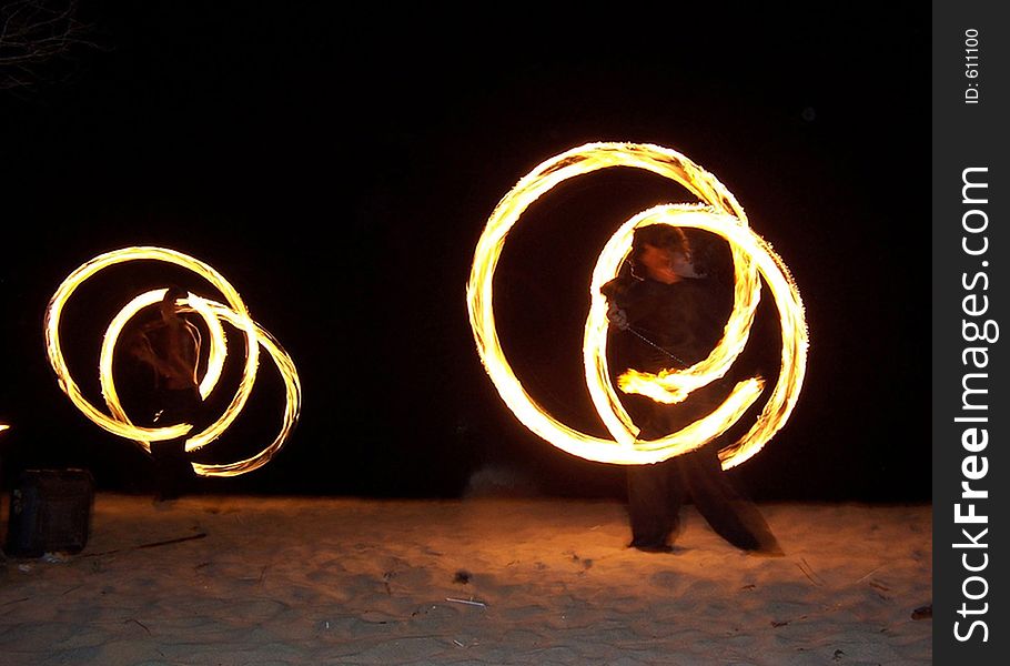 Fire jugling on the beach at night. Fire jugling on the beach at night