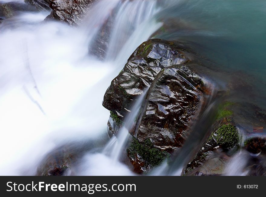 Waterfall stream and big stone. Waterfall stream and big stone