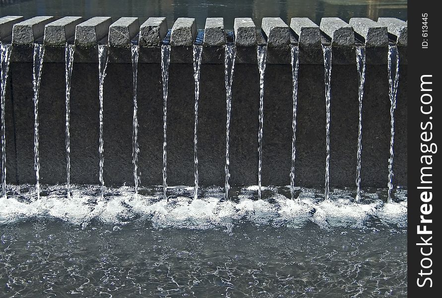 A shot of some water streams in a fountain.