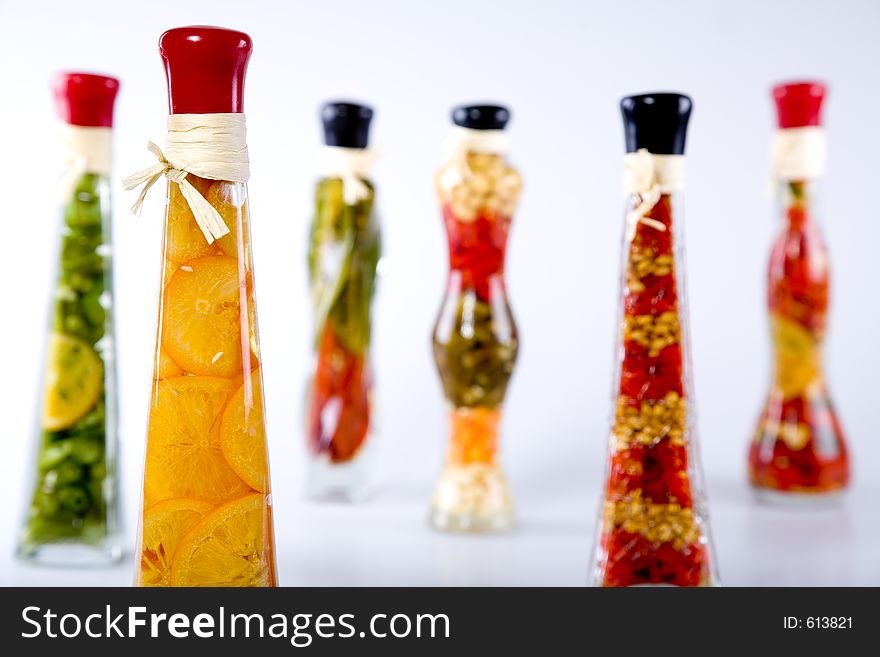 Decorative bottles with sealed colorful fruits and vegetables inside. Decorative bottles with sealed colorful fruits and vegetables inside.