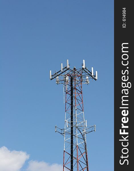 Cellular phone tower against blue sky. Cellular phone tower against blue sky