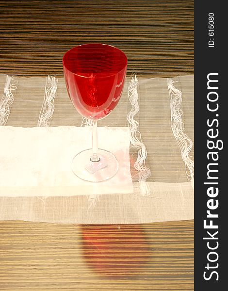 Red wine glass on a table. Red wine glass on a table