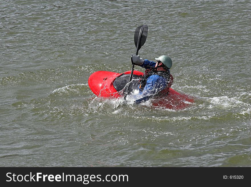 Kayaker practicing recovery from roll over. Kayaker practicing recovery from roll over