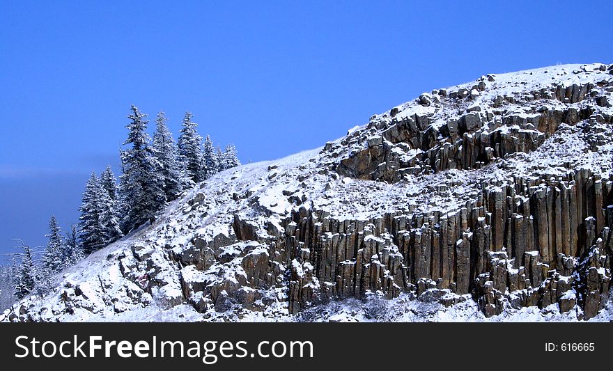 Rock formation and trees/winter