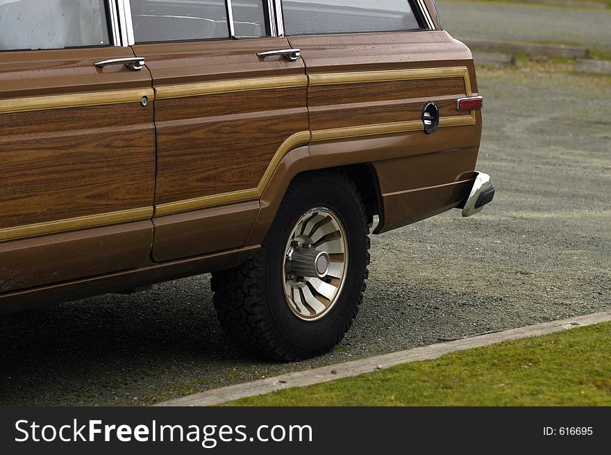 Fake wood panelling on the side of a large seventies family wagon. Fake wood panelling on the side of a large seventies family wagon