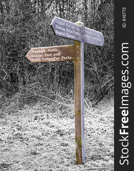 Signpost in country park on a frosty dawn. Signpost in country park on a frosty dawn