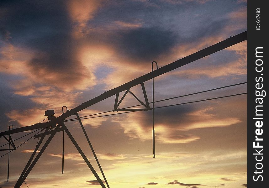 Farm water pipe at sunset