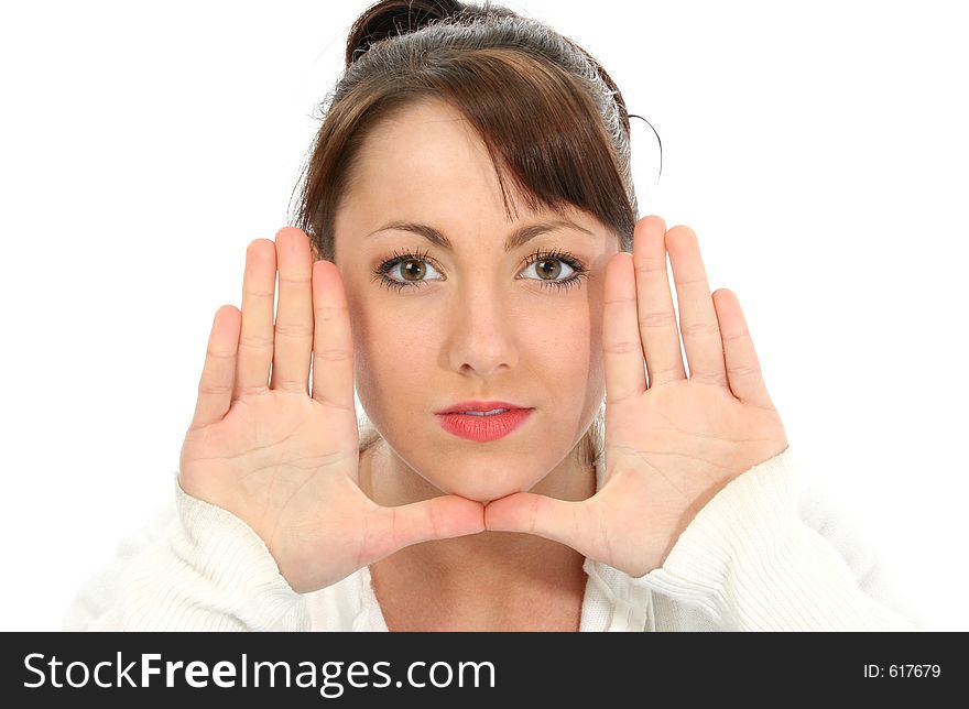 Beautiful young woman with hand, palm out, beside face. Beautiful young woman with hand, palm out, beside face.