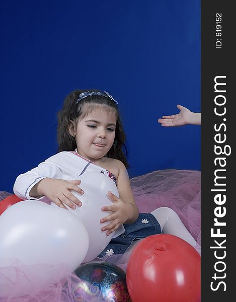 Little pretty girl holding a balloon. Little pretty girl holding a balloon