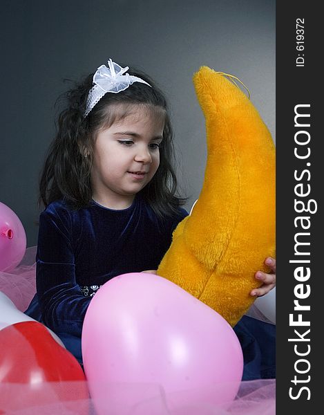 Sweet Young Girl Playing With Her Plush Moon