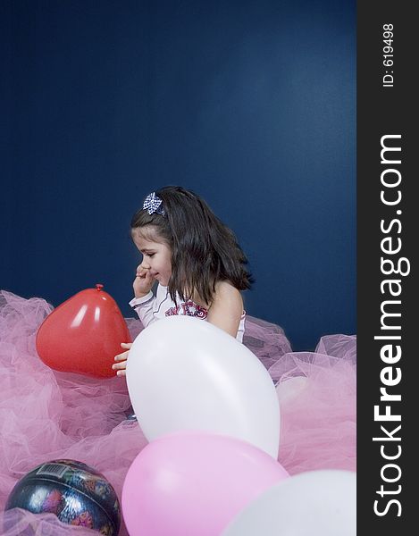 Pretty little girl playing with ballons. Pretty little girl playing with ballons