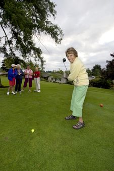 Women Playing Golf Stock Images