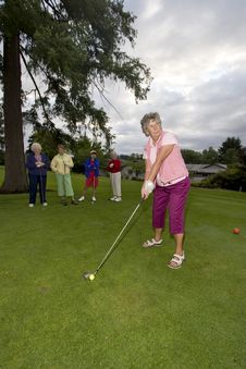 Woman Playing Golf Stock Image