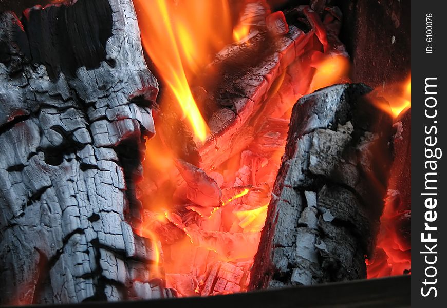 Embers with firewood and flame. background. Ukraine