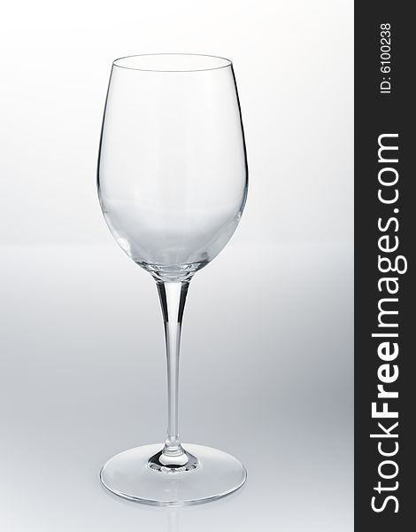 Empty red wine glass on the white reflective table