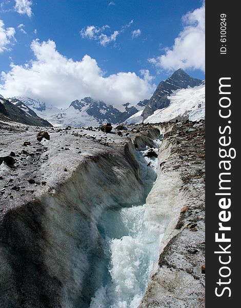 River on glacier in Caucasus mountains