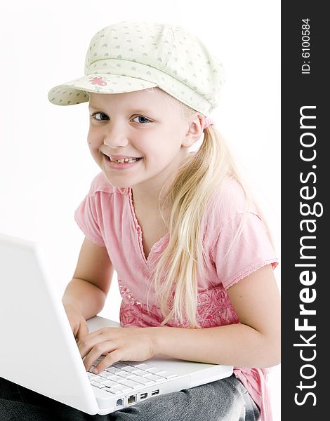 Young girl using a laptop computer over white background
