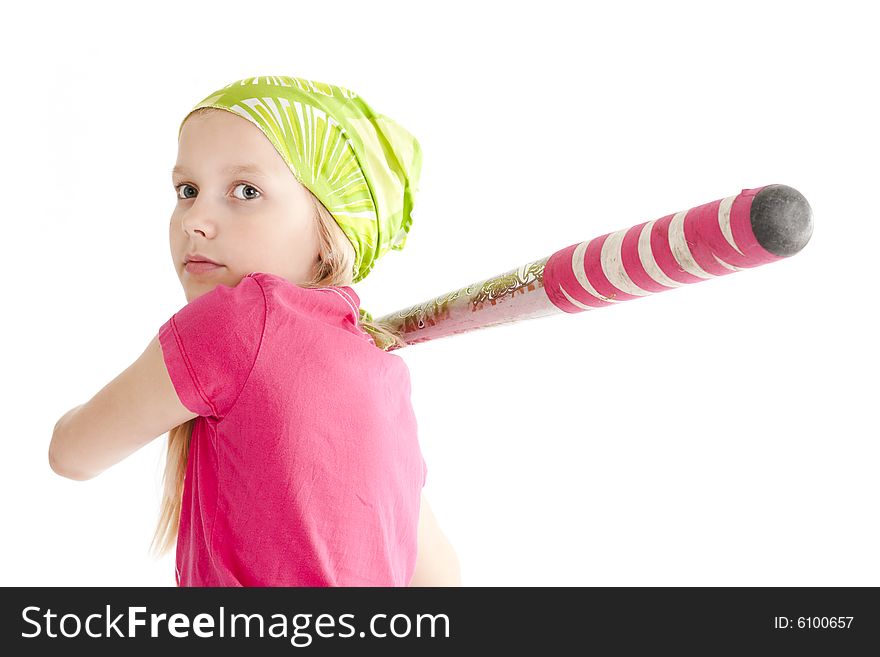 Young softball player hitting the ball with bat