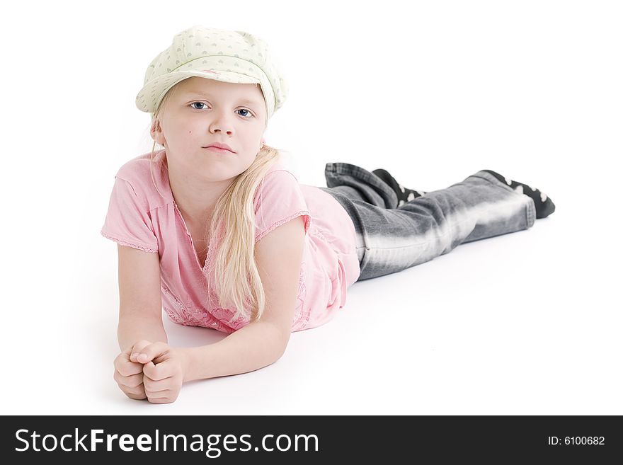 Young girl laying on the floor over white background