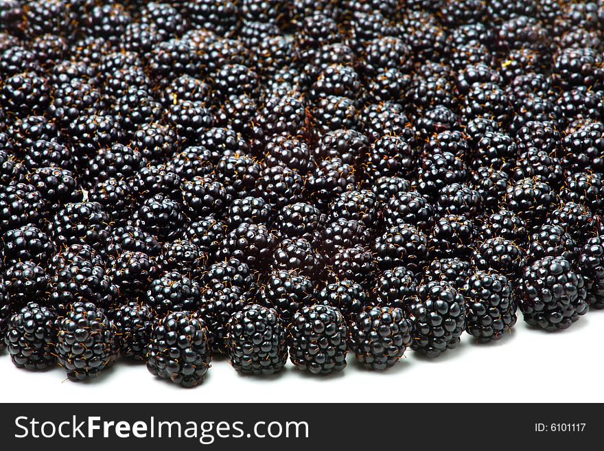 Closeup image of a lot of blackberries isolated on white. Closeup image of a lot of blackberries isolated on white