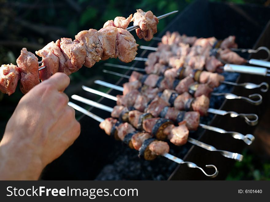 Chunks of meat cooking on barbeque grill. Chunks of meat cooking on barbeque grill