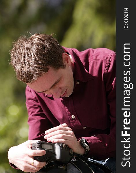 Photographer looking at camera, man with camera