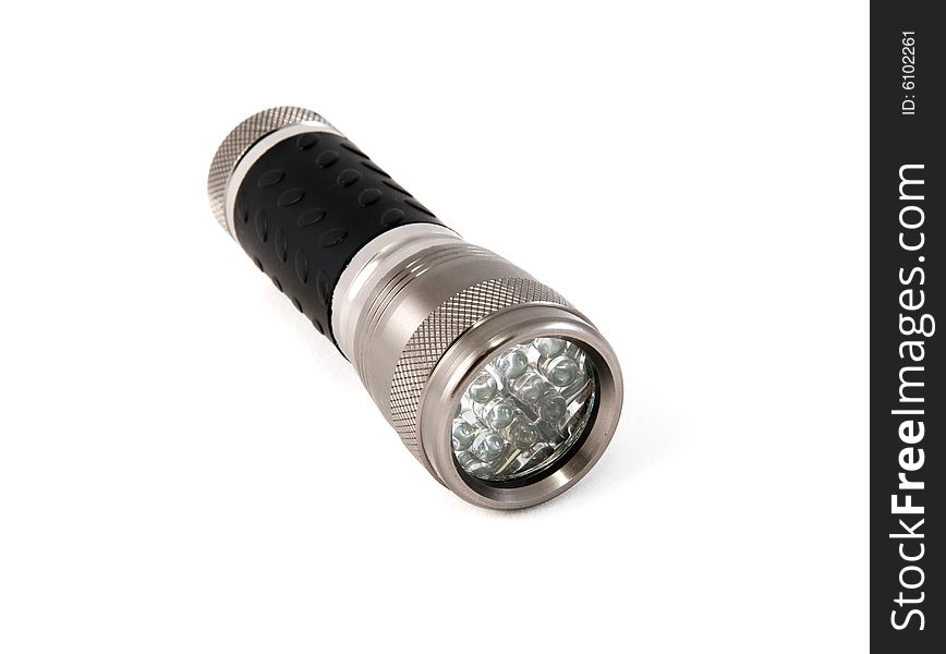 A black flashlight torch on a white seemless background. A black flashlight torch on a white seemless background