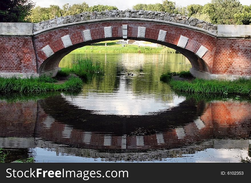 The beautiful old bridge with reflection in water
