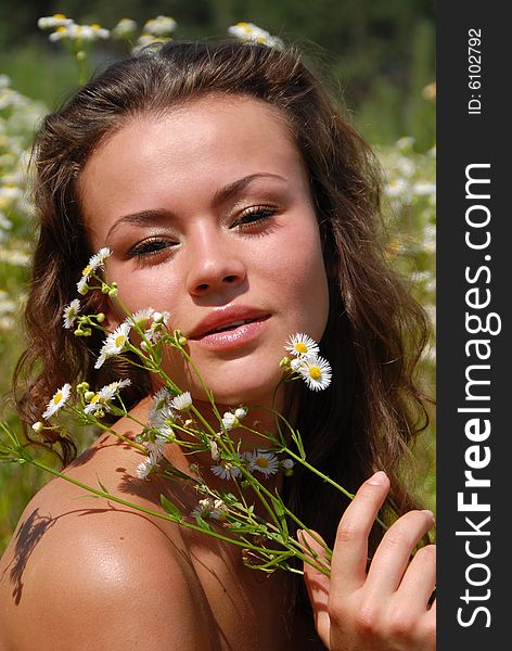 Portrait of the beautiful girl with flowers. Portrait of the beautiful girl with flowers