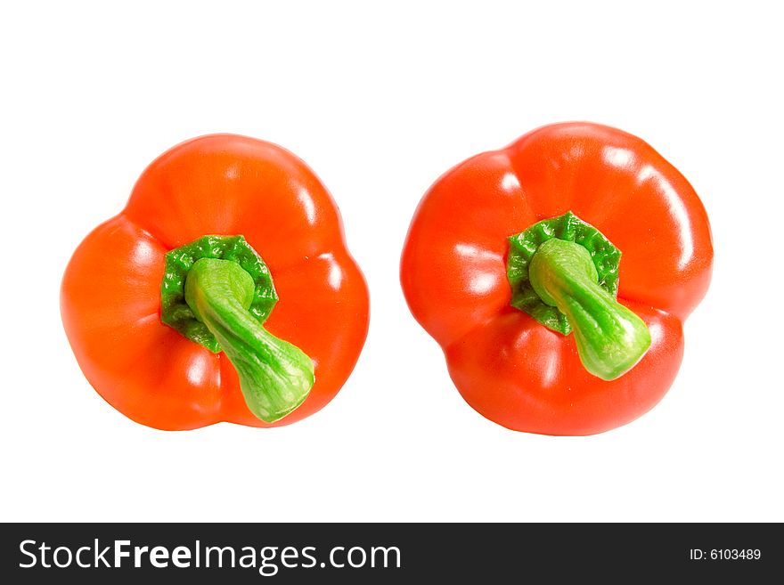 Two sweet red peppers on white ground. Two sweet red peppers on white ground