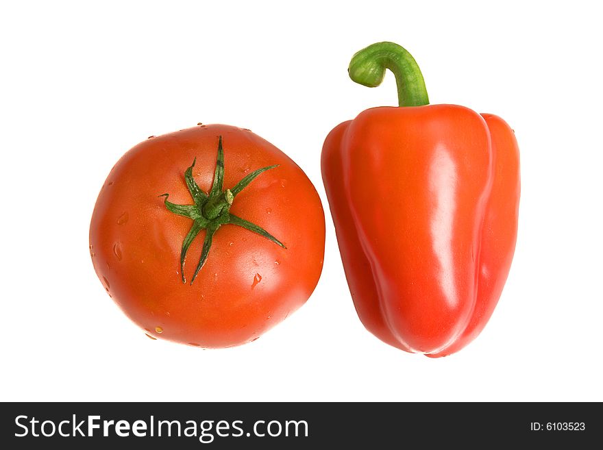 Pepper and tomato on white ground