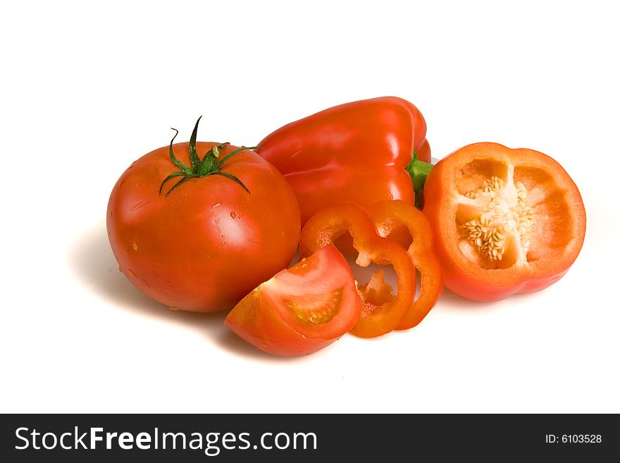 Pepper and tomato on white ground