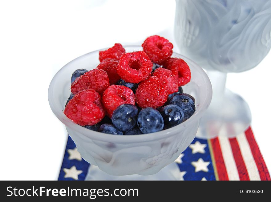 Raspberries and blueberries on a patriotic napkin. Raspberries and blueberries on a patriotic napkin.