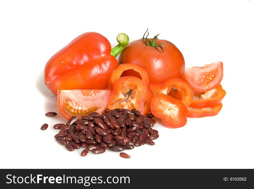 Pepper, tomato and beans on white ground