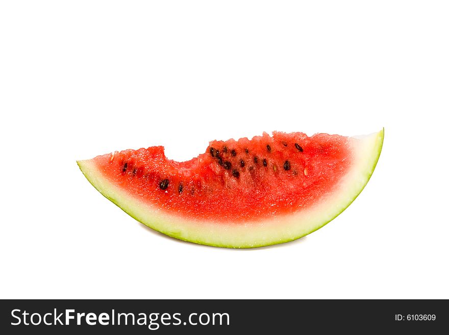 Bited off watermelon on white ground