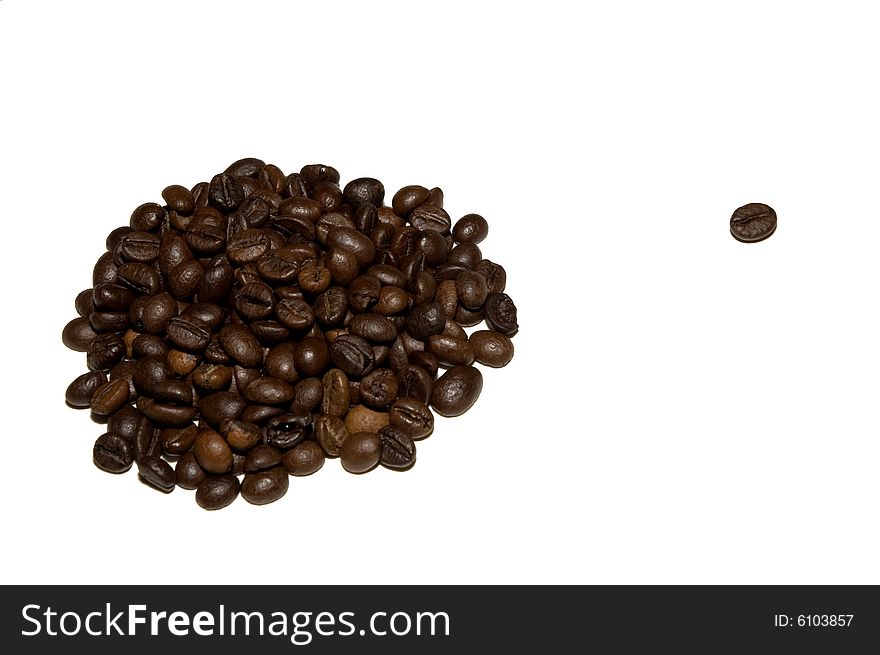 A heap of coffee beans with one singled out bean isolated on white. A heap of coffee beans with one singled out bean isolated on white