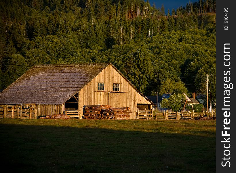 Old wooden barn at sunset