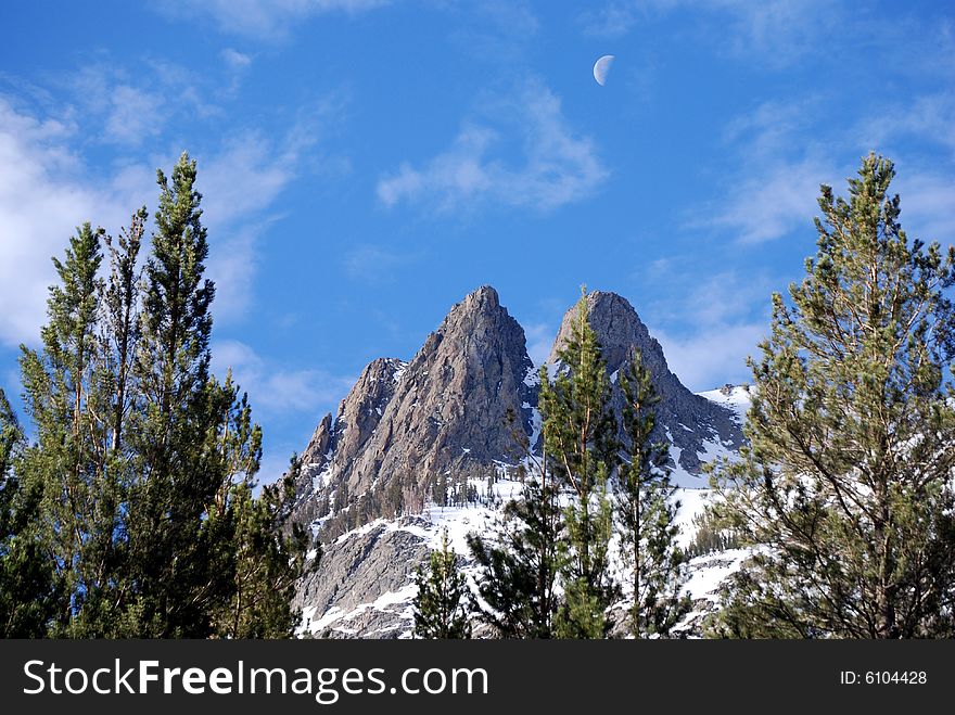 Sunrise over June Lake  peak, while the moon is still out. Sunrise over June Lake  peak, while the moon is still out