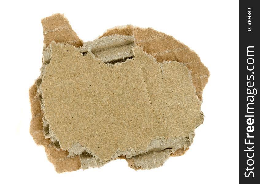 Torn piece of corrugated fiberboard isolated on a white background