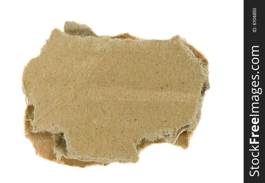 Torn piece of corrugated fiberboard isolated on a white background