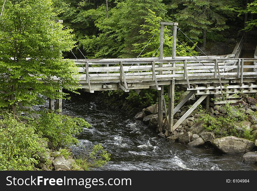 Wooden bridge over a small river
